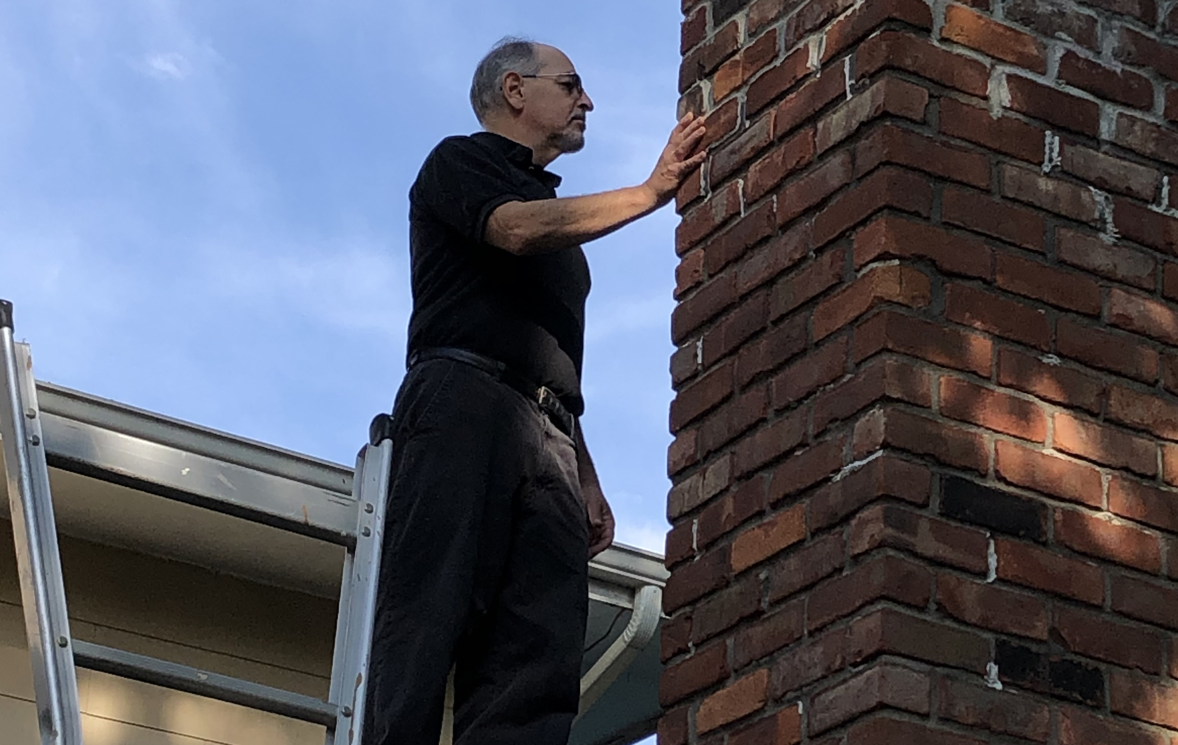 Man Checking Walls At Home